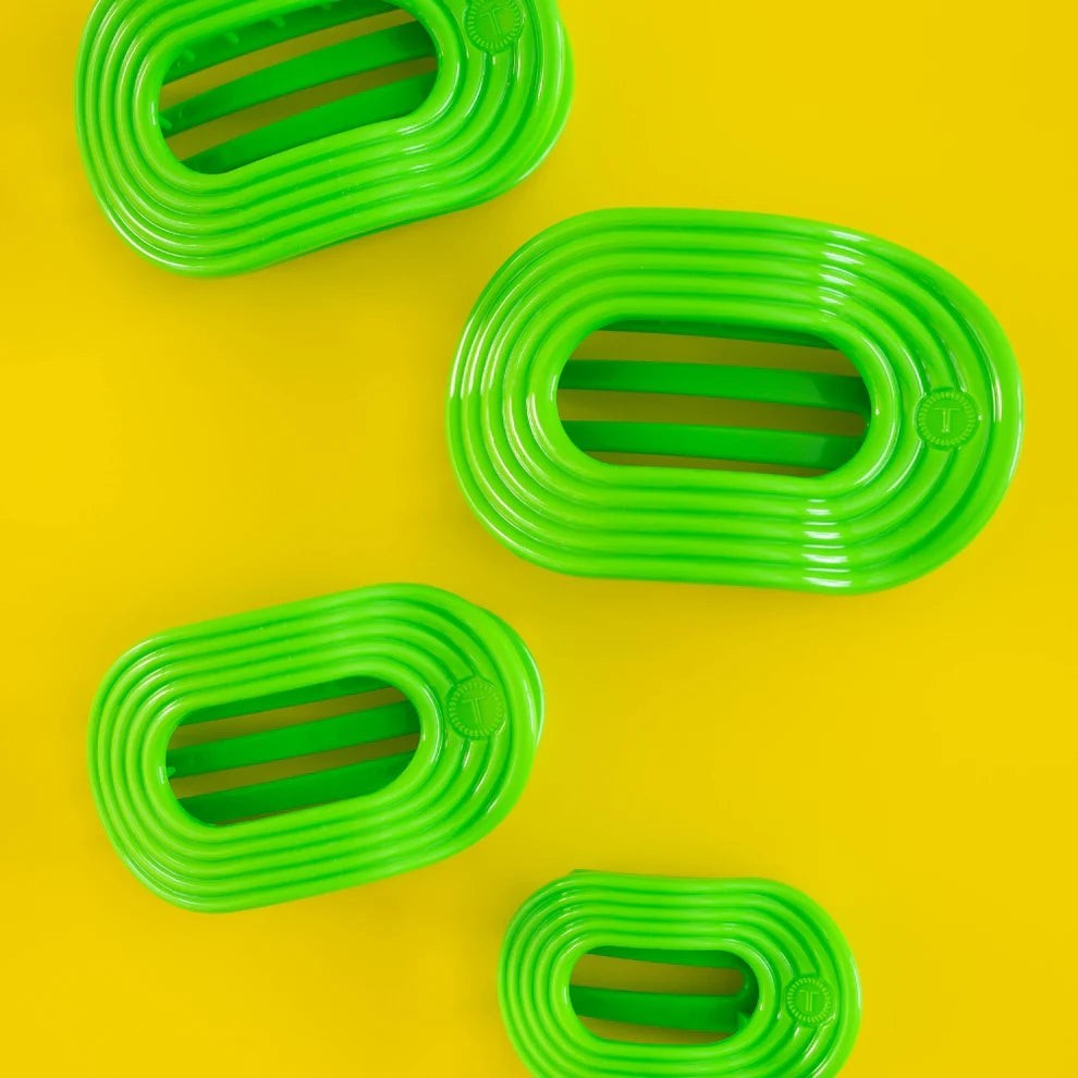 Doodlations Coffee Bar & Boutique Teleties Glow For It flat round lime green hair clip with a textured design.