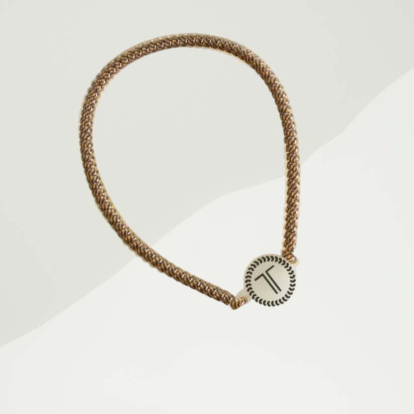 Doodlations Coffee Bar & Boutique Teleties Morning Brew headband in a braided brown pattern with a rubber logo charm.