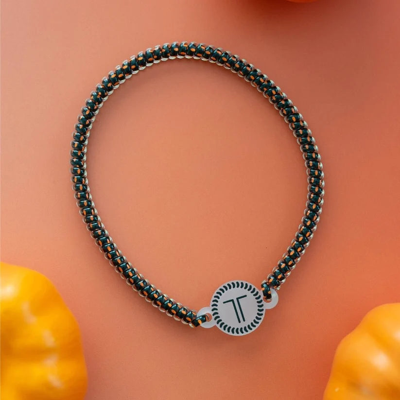 Doodlations Coffee Bar & Boutique Teleties spiral coil headband in orange and black with a secure rubber stopper.