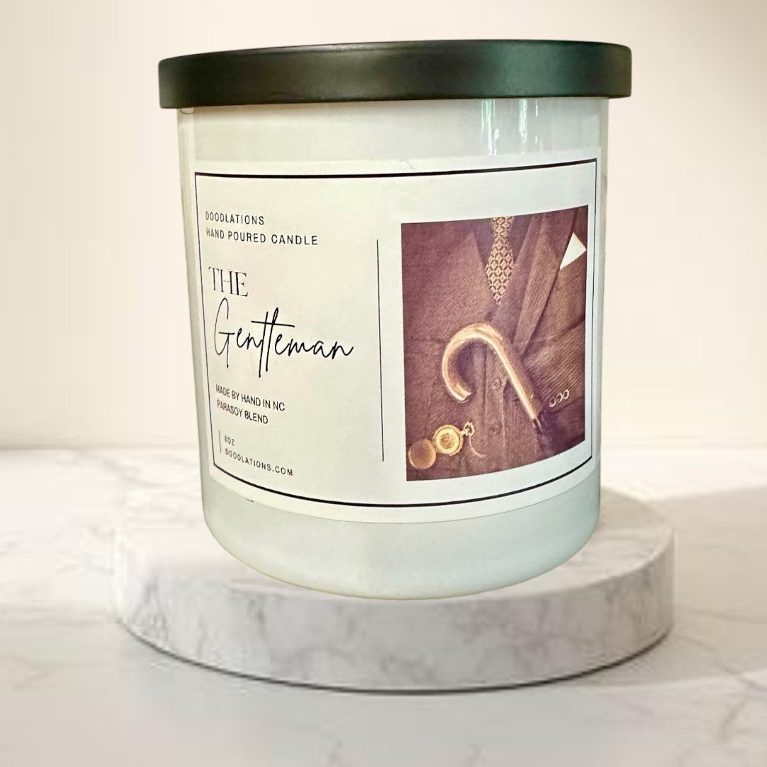 Doodlations Coffee Bar & Boutique The Gentleman luxury soy blend candle with masculine cologne scent. Hand-poured.