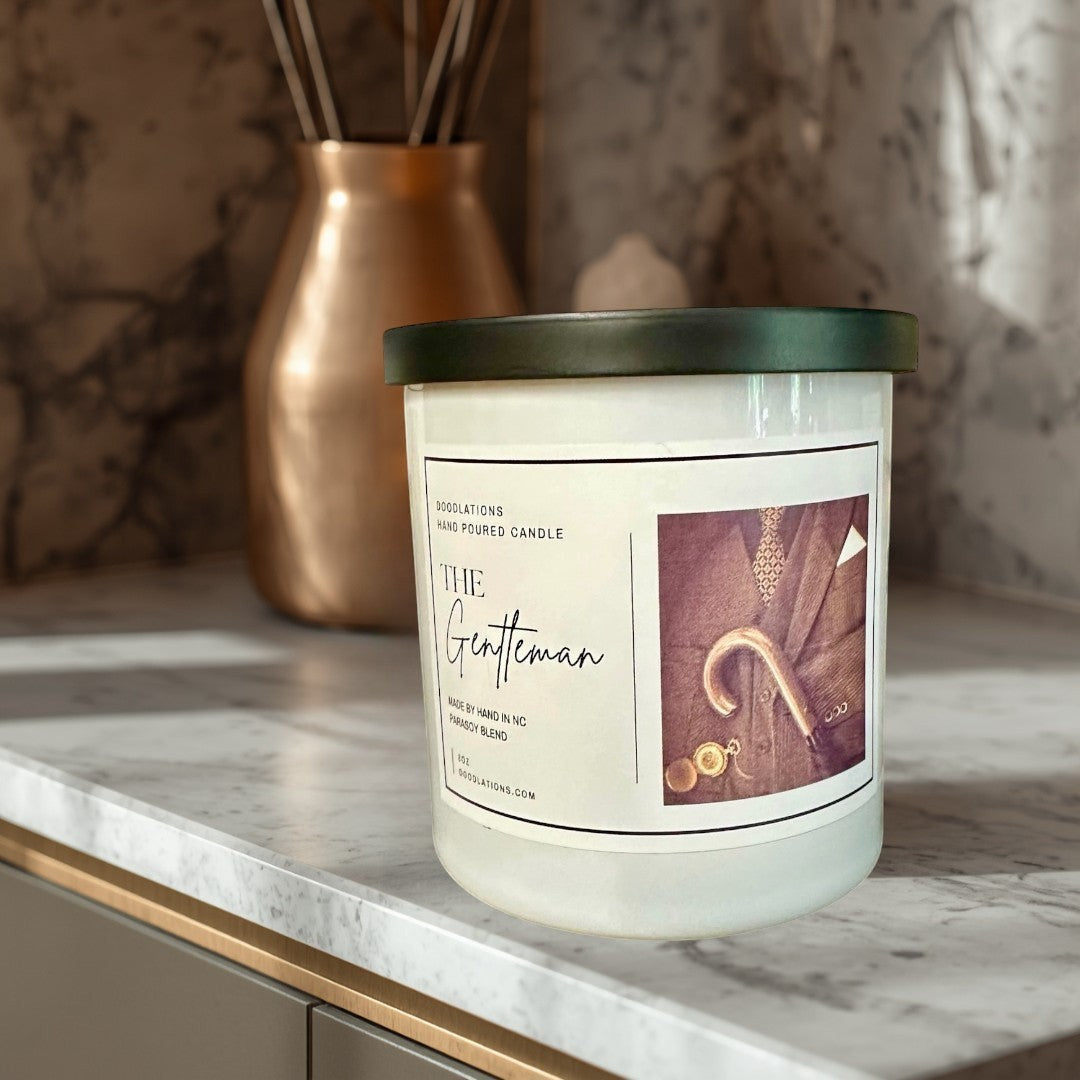 Doodlations Coffee Bar & Boutique The Gentleman luxury soy blend candle with masculine cologne scent. Hand-poured.