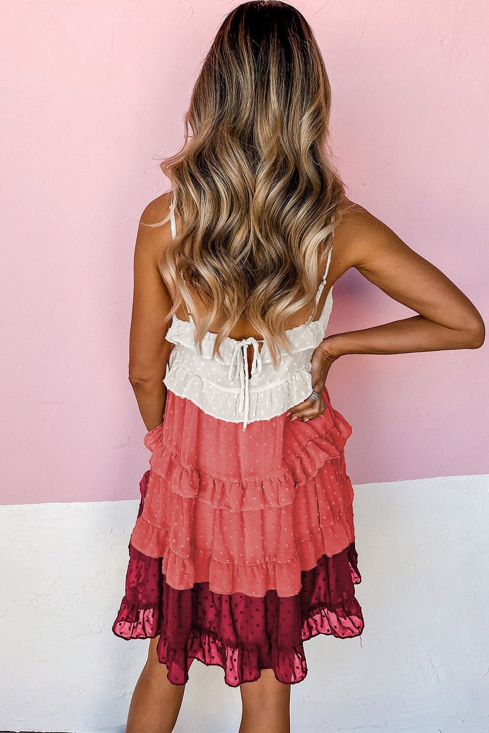 Doodlations Coffee Bar & Boutique tiered ruffle mini dress in cream, coral, and burgundy Swiss dot fabric with tie-back.