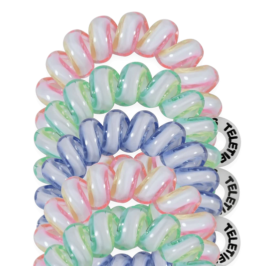 Doodlations Coffee Bar & Boutique Shades of Summer tiny coil hair ties in pastel pink, green, and blue on black.