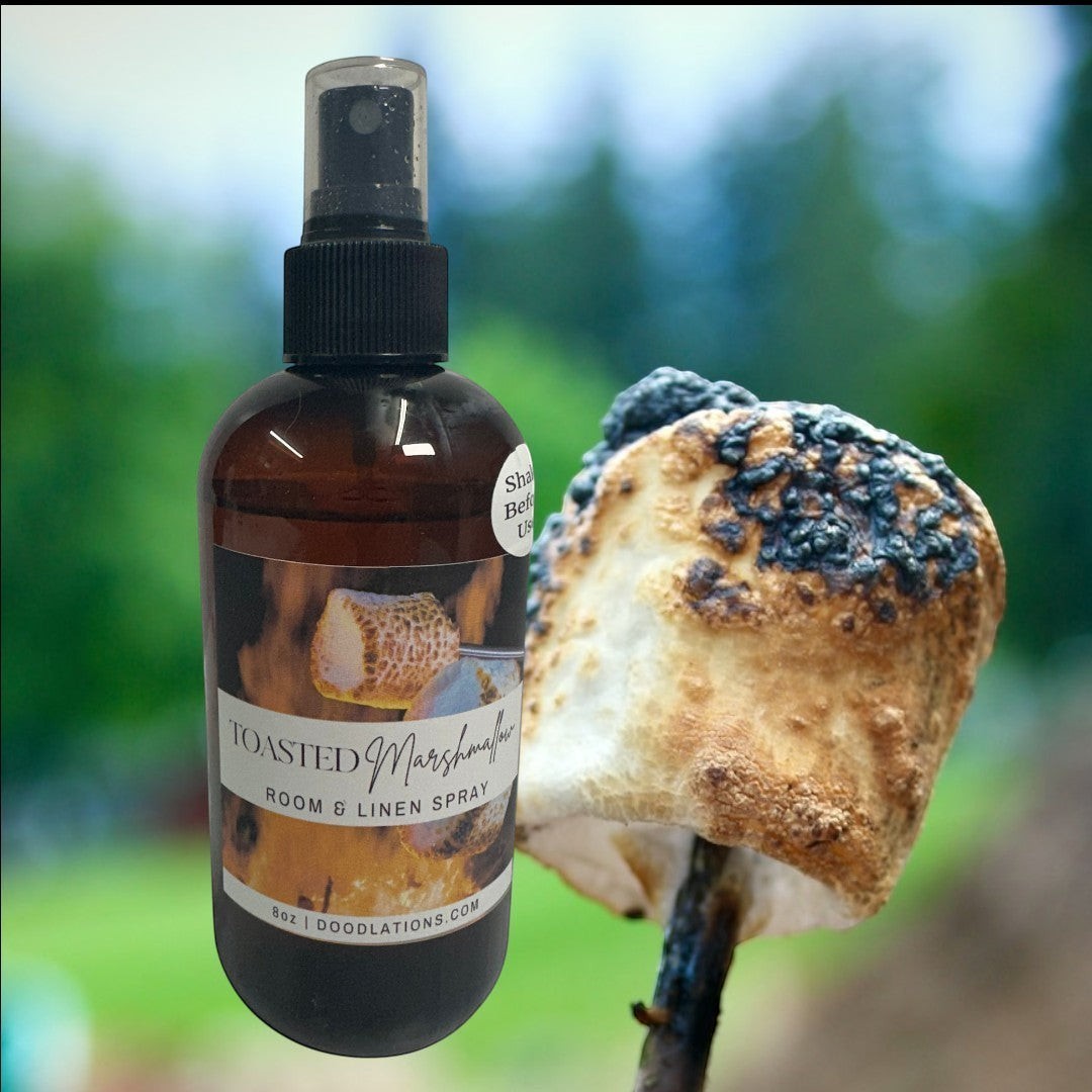 Doodlations Coffee Bar & Boutique Toasted Marshmallow room and linen spray in amber bottle with black spray top.