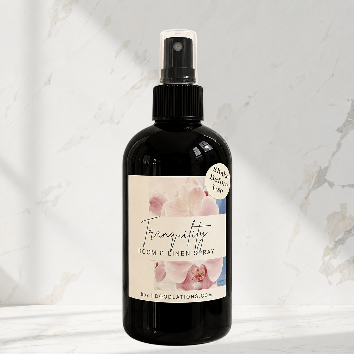 Doodlations Coffee Bar & Boutique Tranquility room and linen spray in a black bottle with a floral label