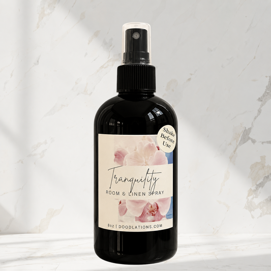 Doodlations Coffee Bar & Boutique Tranquility room and linen spray in a black bottle with a floral label