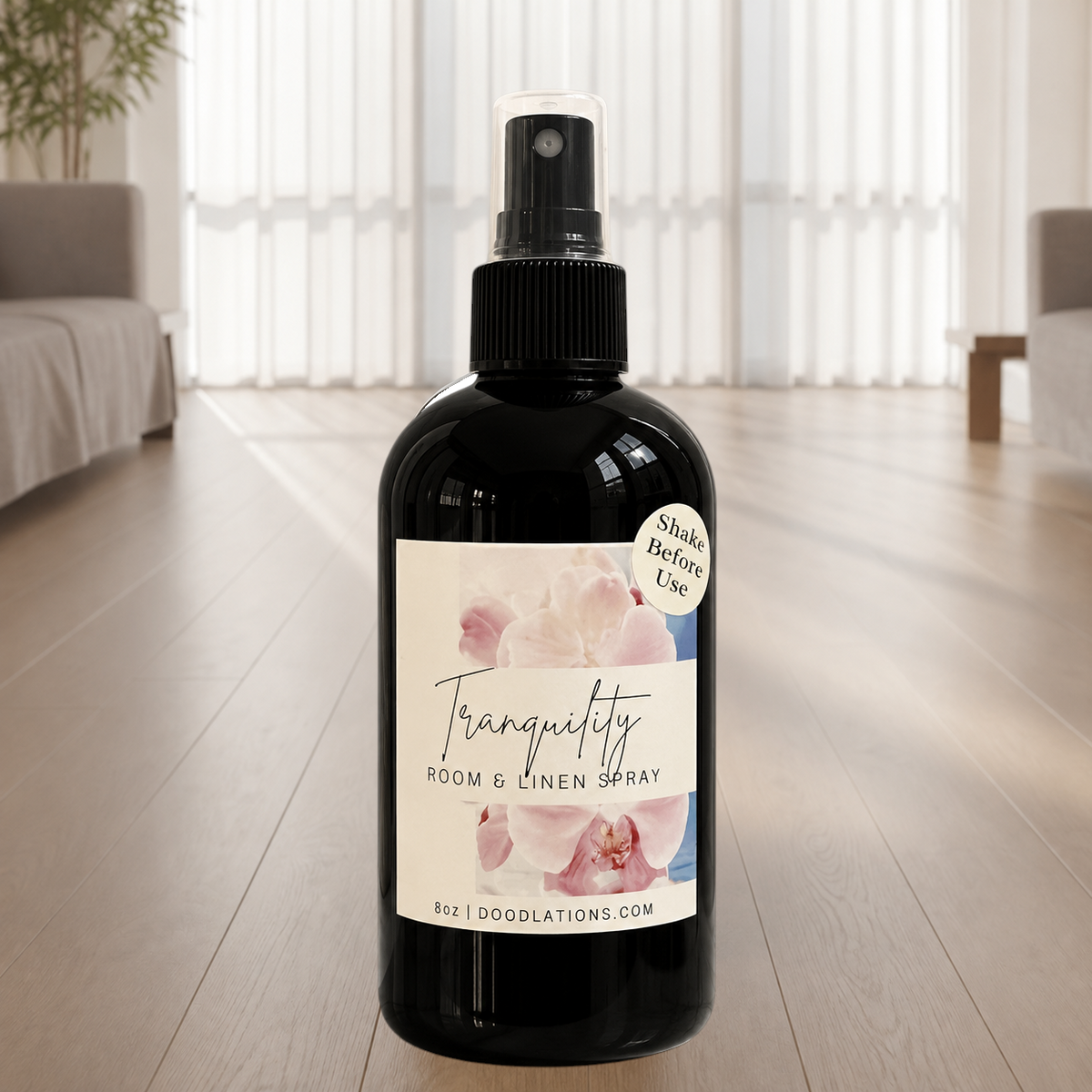Doodlations Coffee Bar & Boutique Tranquility room and linen spray in a black bottle with a floral label.