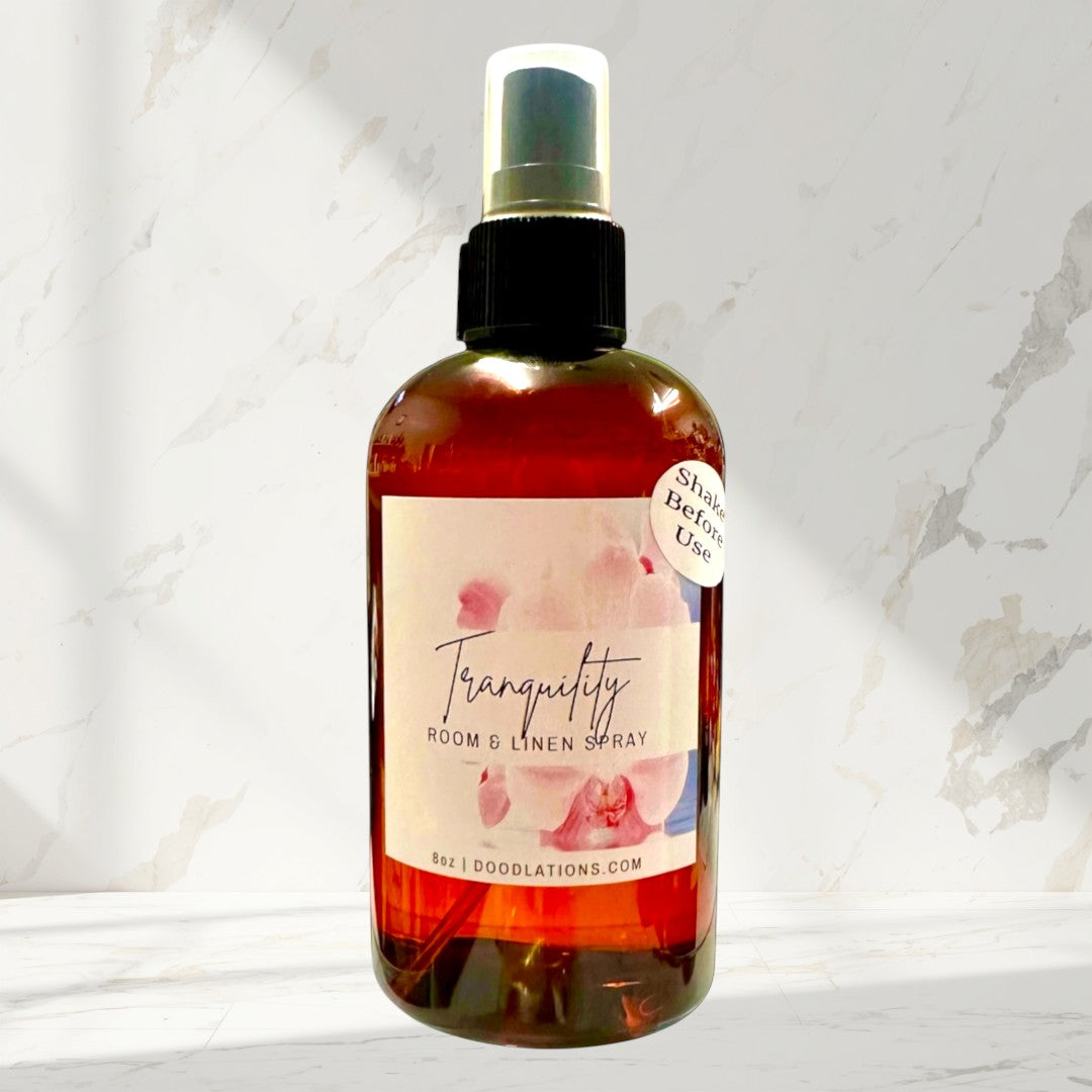 Doodlations Coffee Bar & Boutique Tranquility Room & Linen Spray with lemongrass, clove, lavender, and musk scents. 8oz bottle.