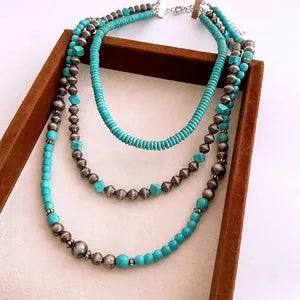 Doodlations Coffee Bar & Boutique layered beaded necklace with turquoise-toned beads and metallic accents
