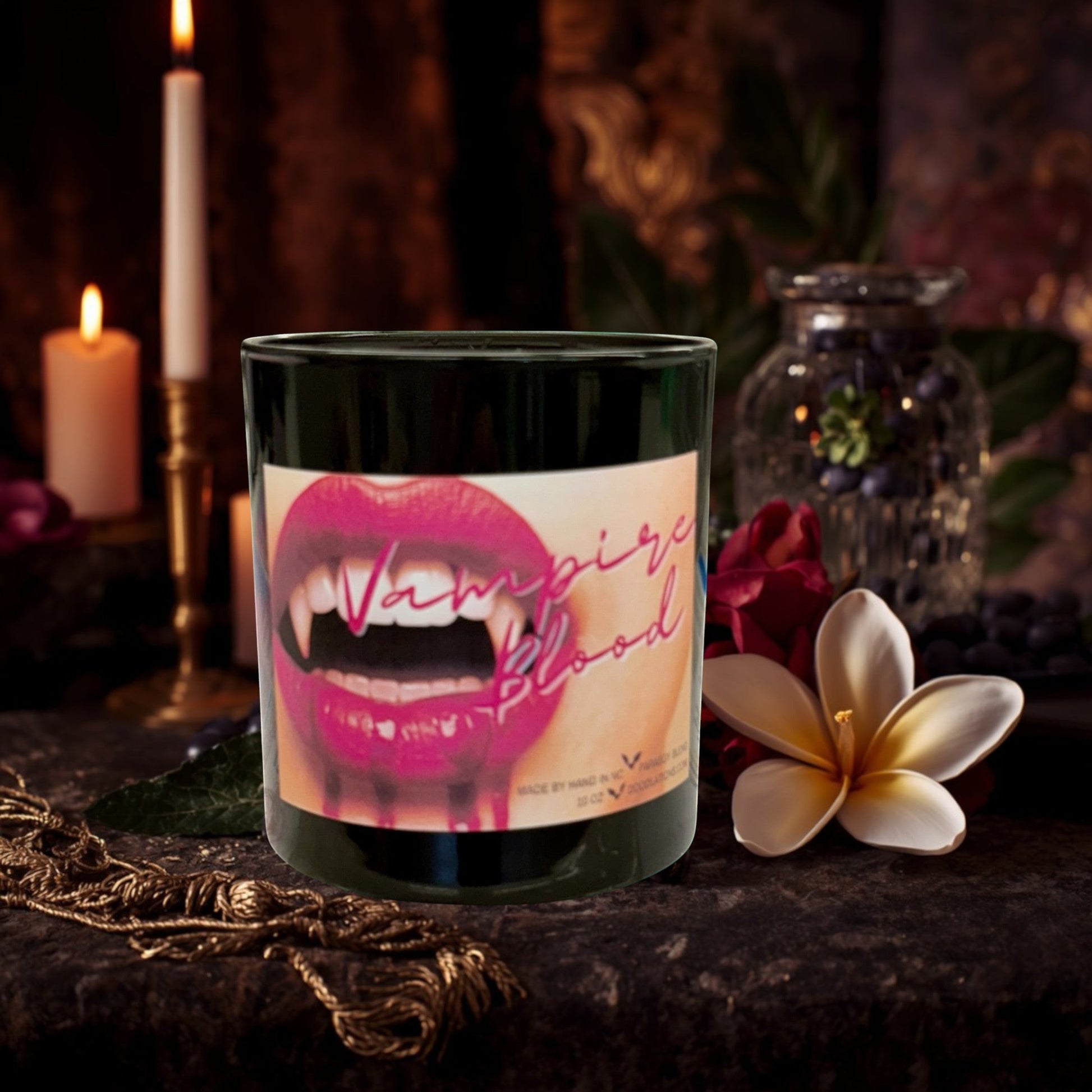 Doodlations Coffee Bar & Boutique Vampire Blood luxury candle with decorative wax fangs and bats. Bold, mysterious scent.