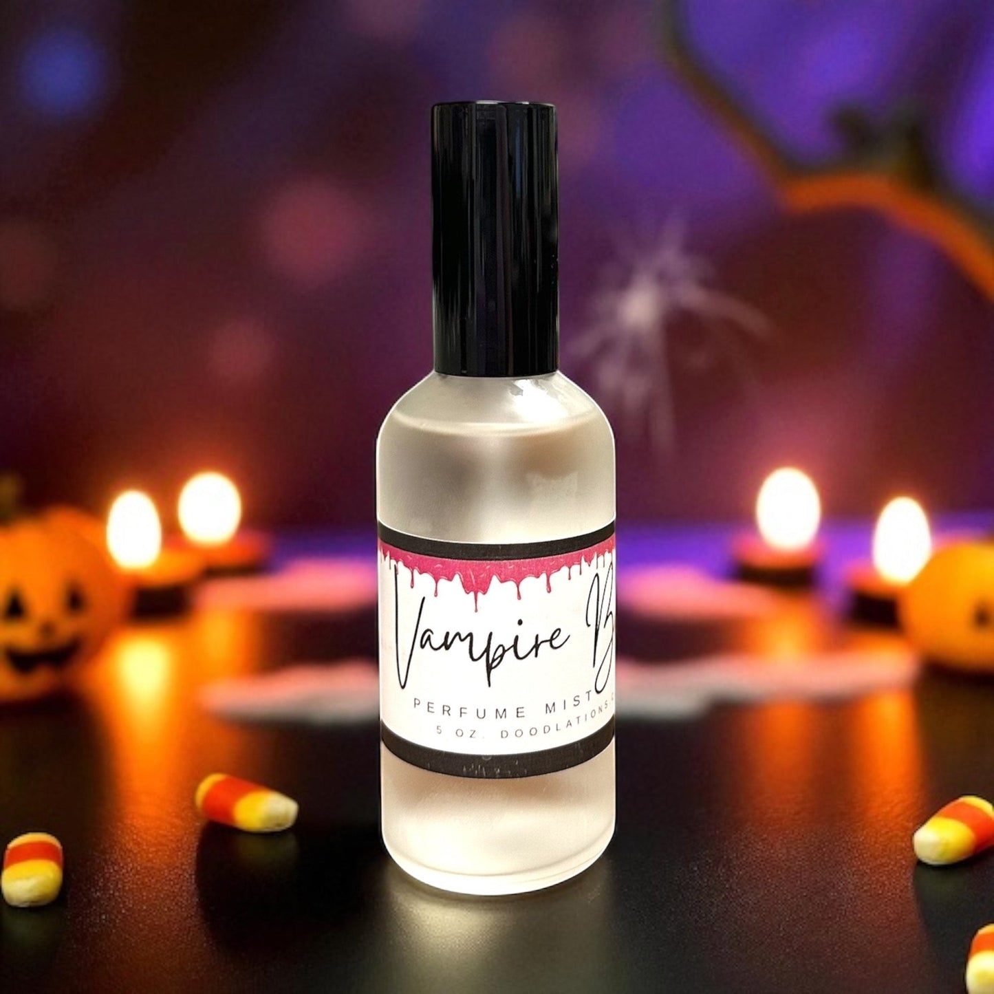 Doodlations Coffee Bar & Boutique Vampire Blood fine mist perfume in a glass bottle with a black cap on a spooky table