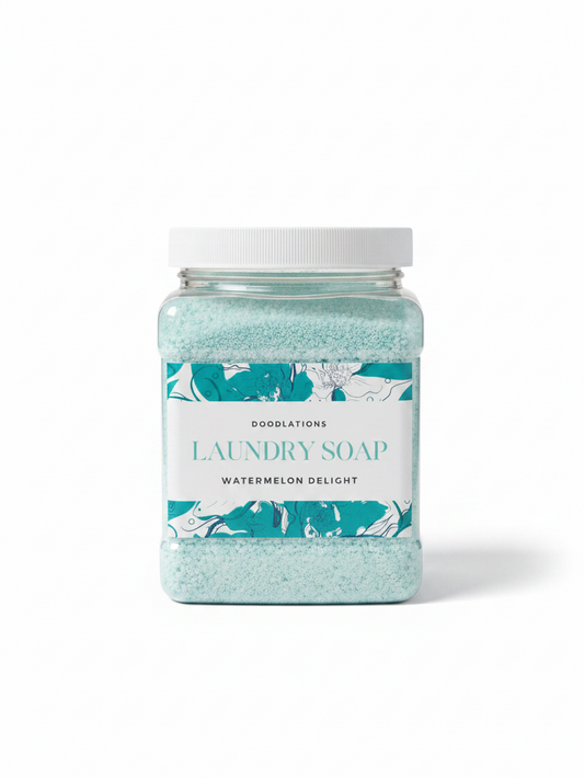 Doodlations Coffee Bar & Boutique Watermelon Delight luxury laundry powder in a clear square jar with teal granules
