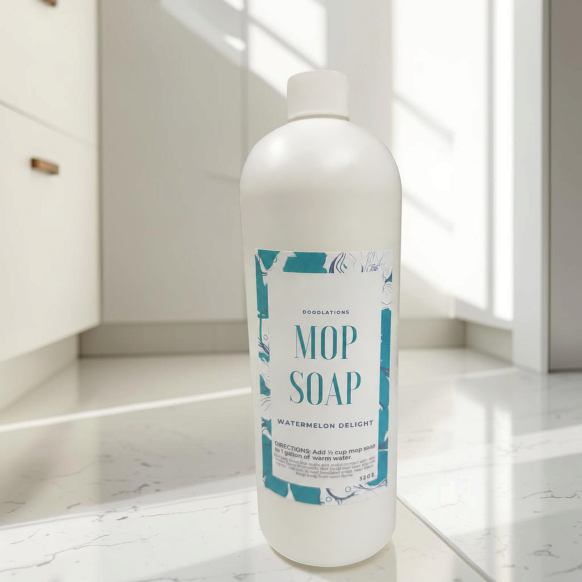 Doodlations Coffee Bar & Boutique 32 oz concentrated mop soap in Watermelon Delight scent in a white plastic bottle.