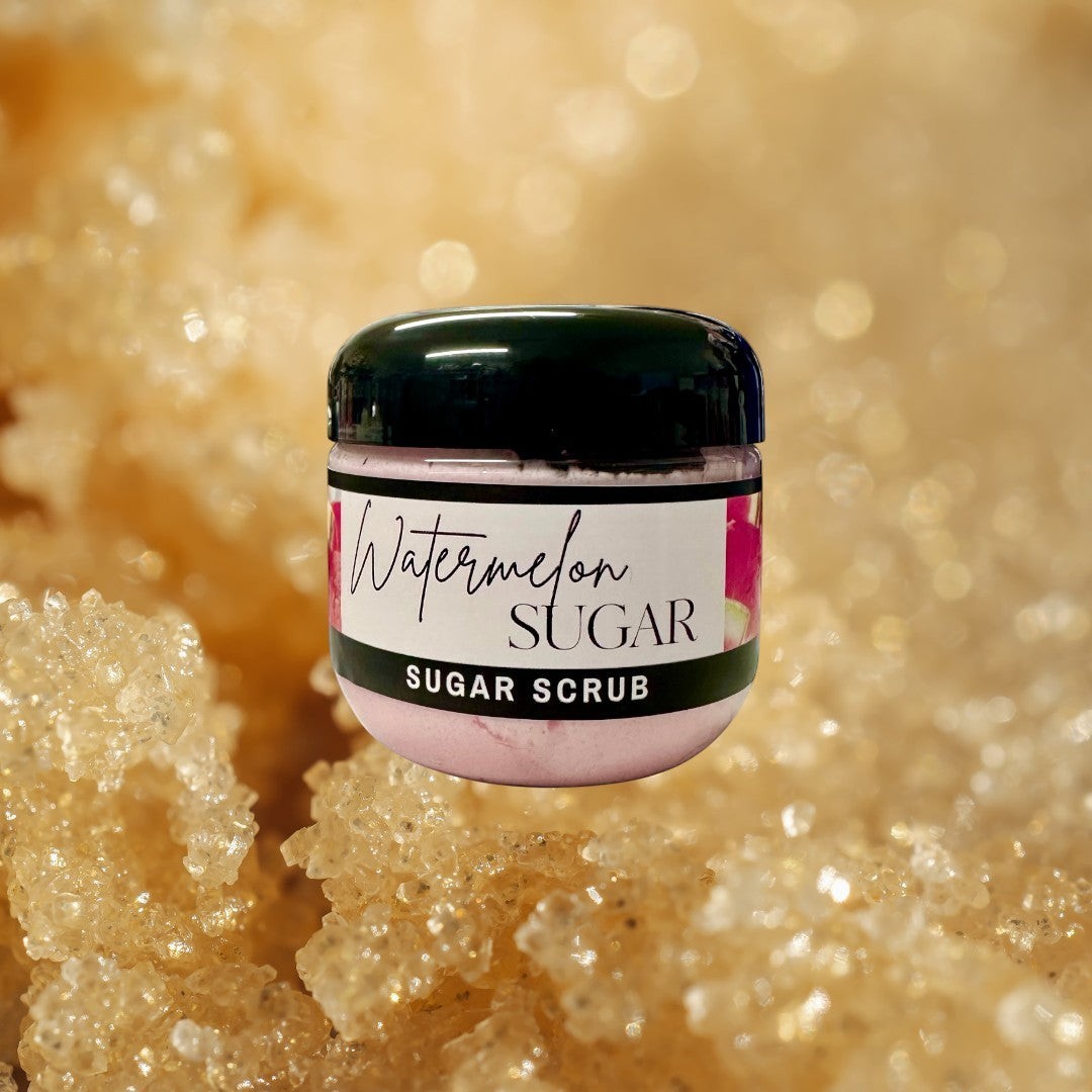 Doodlations Coffee Bar & Boutique Watermelon Sugar Scrub in a clear jar with a black lid. Pink scrub with watermelon imagery on the label.