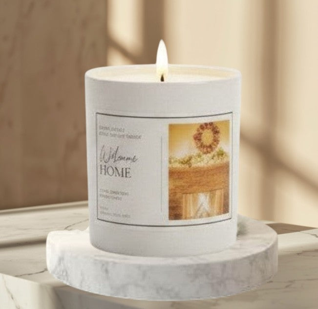 Doodlations Coffee Bar & Boutique Welcome Home luxury soy blend candle with a warm cinnamon, clove, orange, and vanilla scent.