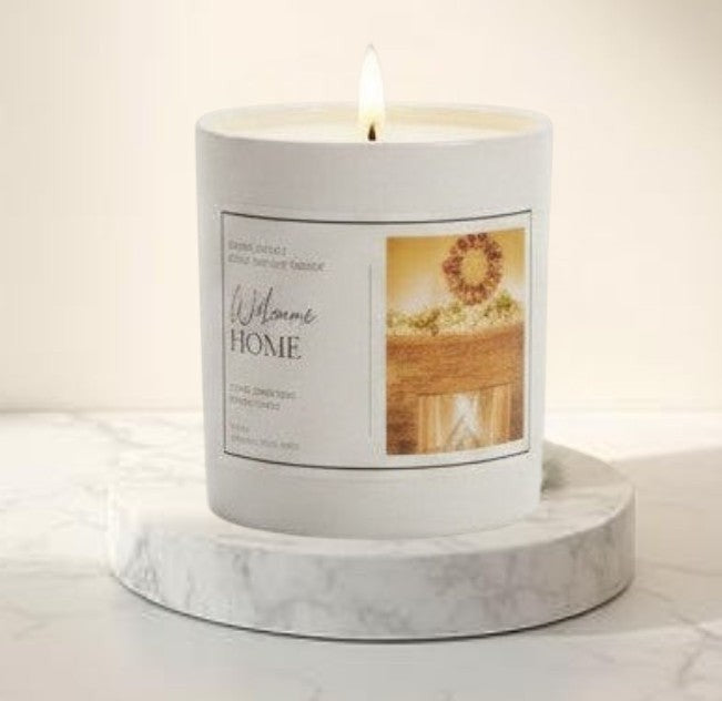Doodlations Coffee Bar & Boutique Welcome Home luxury soy blend candle with a warm cinnamon, clove, orange, and vanilla scent.