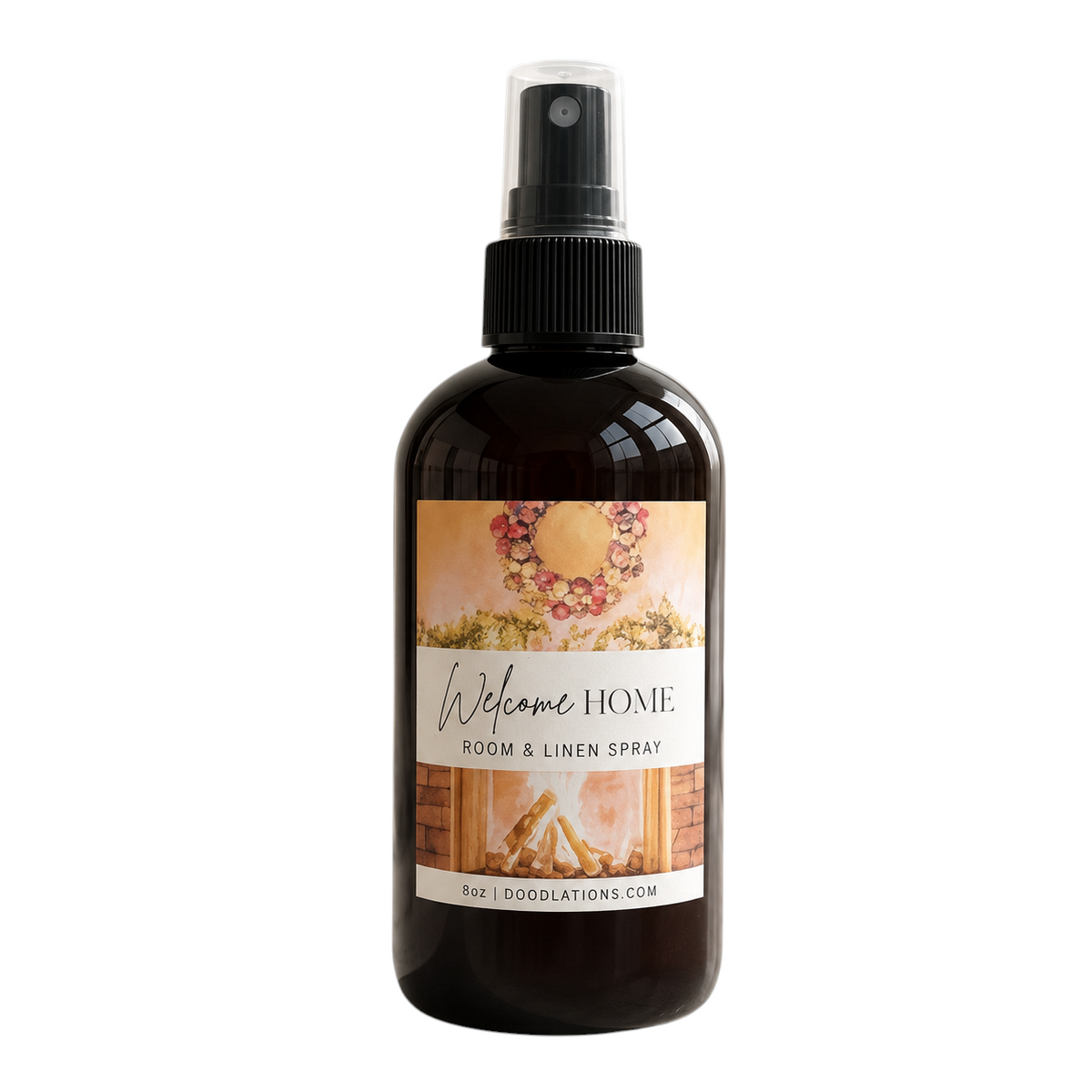 Doodlations Coffee Bar & Boutique Welcome Home room and linen spray in an amber bottle with a cozy fireplace label.