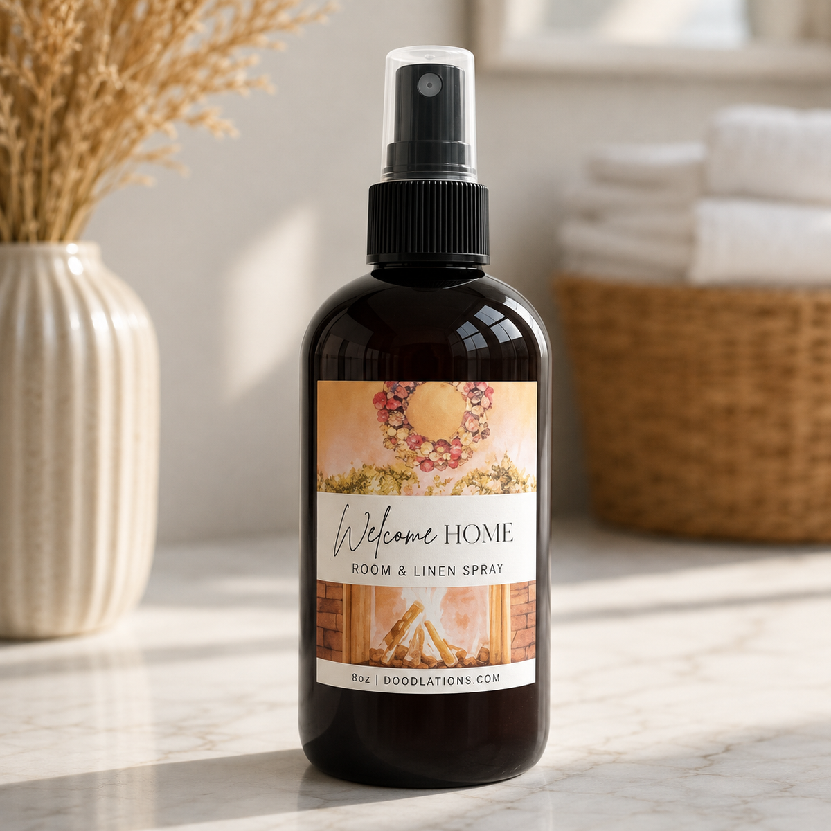 Doodlations Coffee Bar & Boutique Welcome Home room and linen spray in an amber glass bottle with a fireplace label.