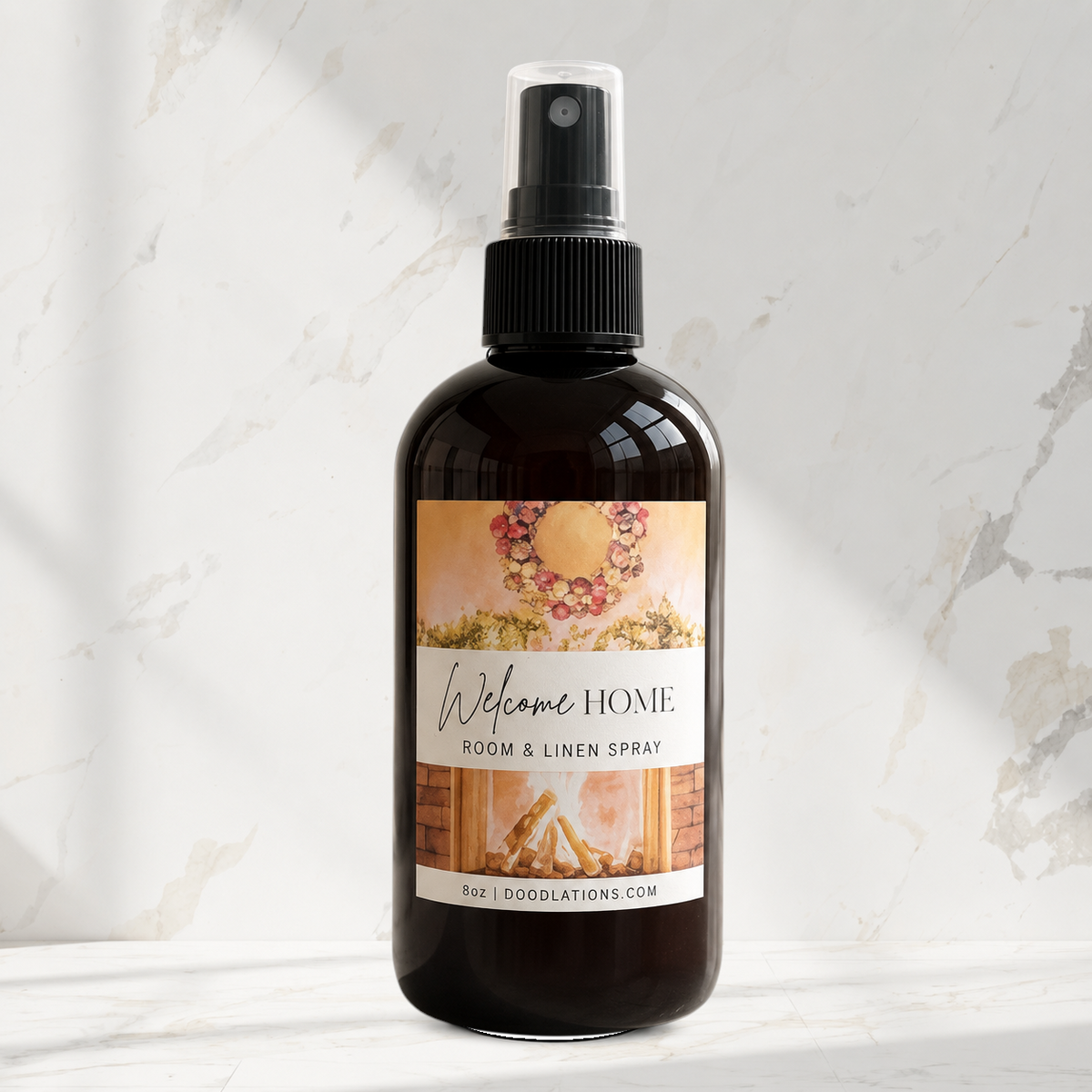 Doodlations Coffee Bar & Boutique Welcome Home room and linen spray in an amber bottle with a fireplace label