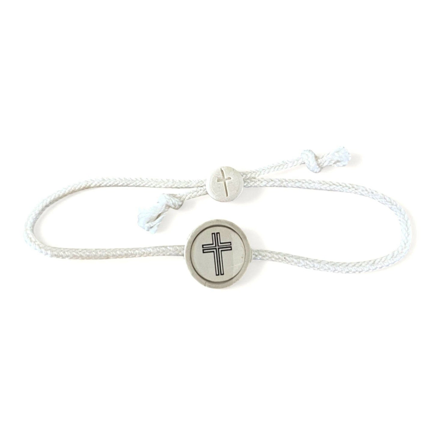 Doodlations Coffee Bar & Boutique white cord bracelet with a central cross charm and adjustable slider.