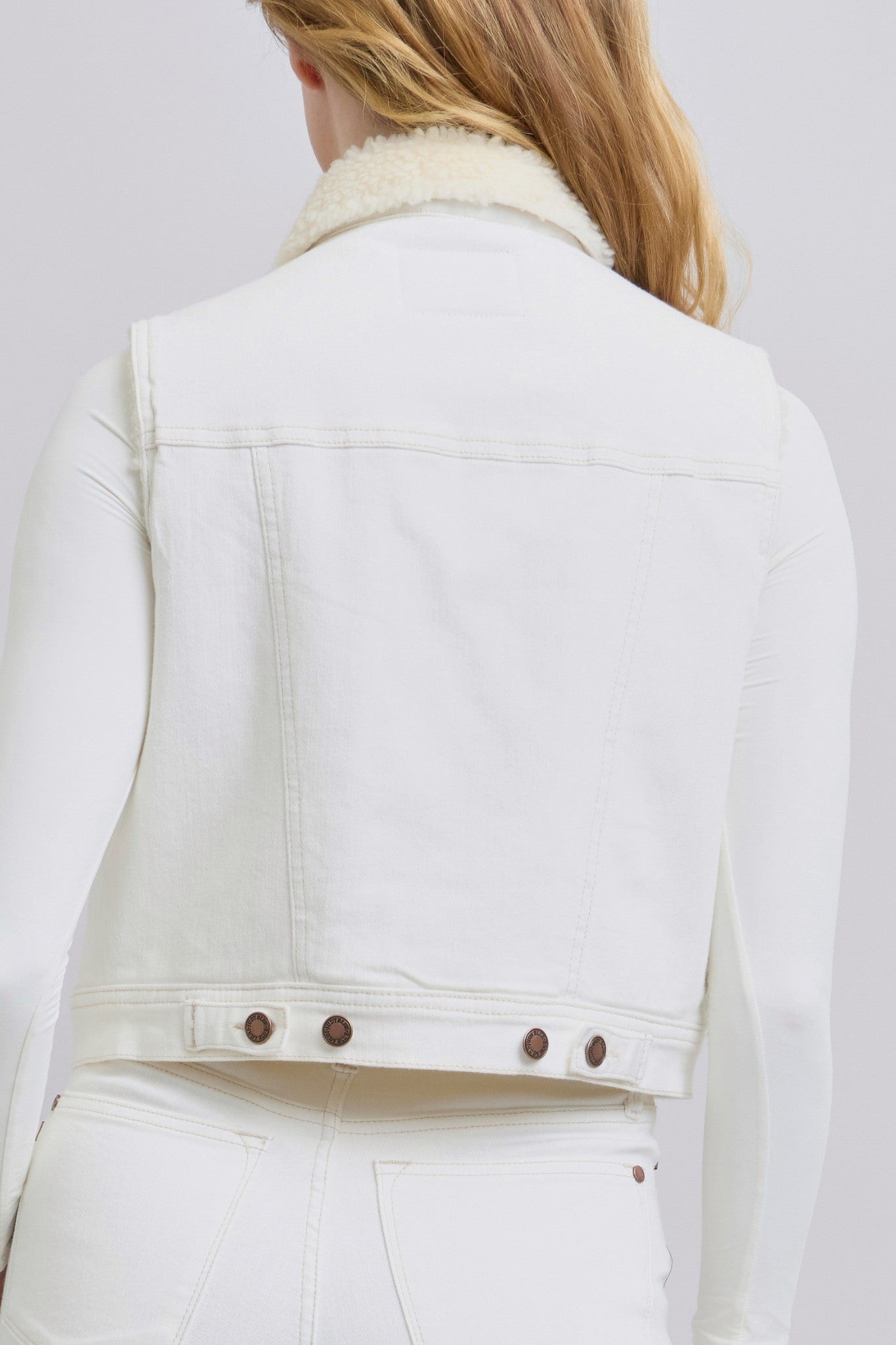 Doodlations Coffee Bar & Boutique Judy Blue white denim vest with sherpa lining, back view on a model