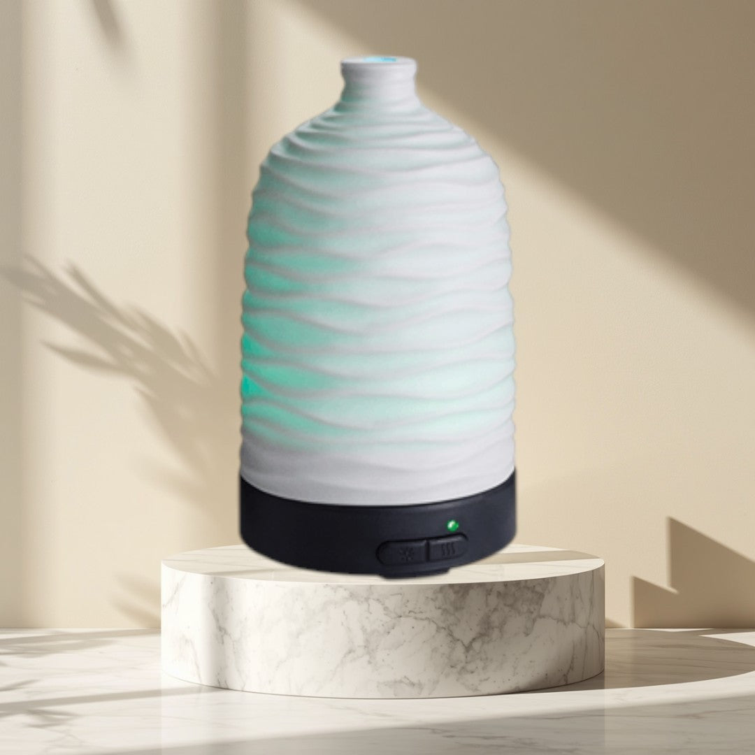 Doodlations Coffee Bar & Boutique white wavy ceramic aroma diffuser with green LED light