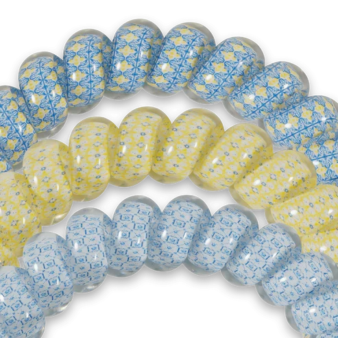 Doodlations Coffee Bar & Boutique Ciao Bella hair ties in a pack of three with yellow and blue patterned spiral designs.