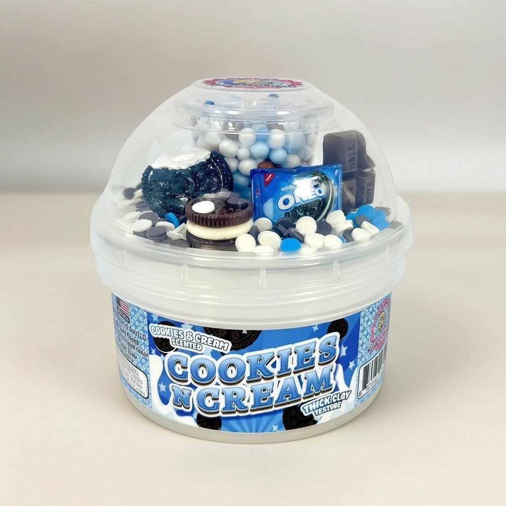 Doodlations Coffee Bar & Boutique Cookies and Cream Scented Slime with Oreo charms, sprinkles, and chocolate pieces in a clear container.
