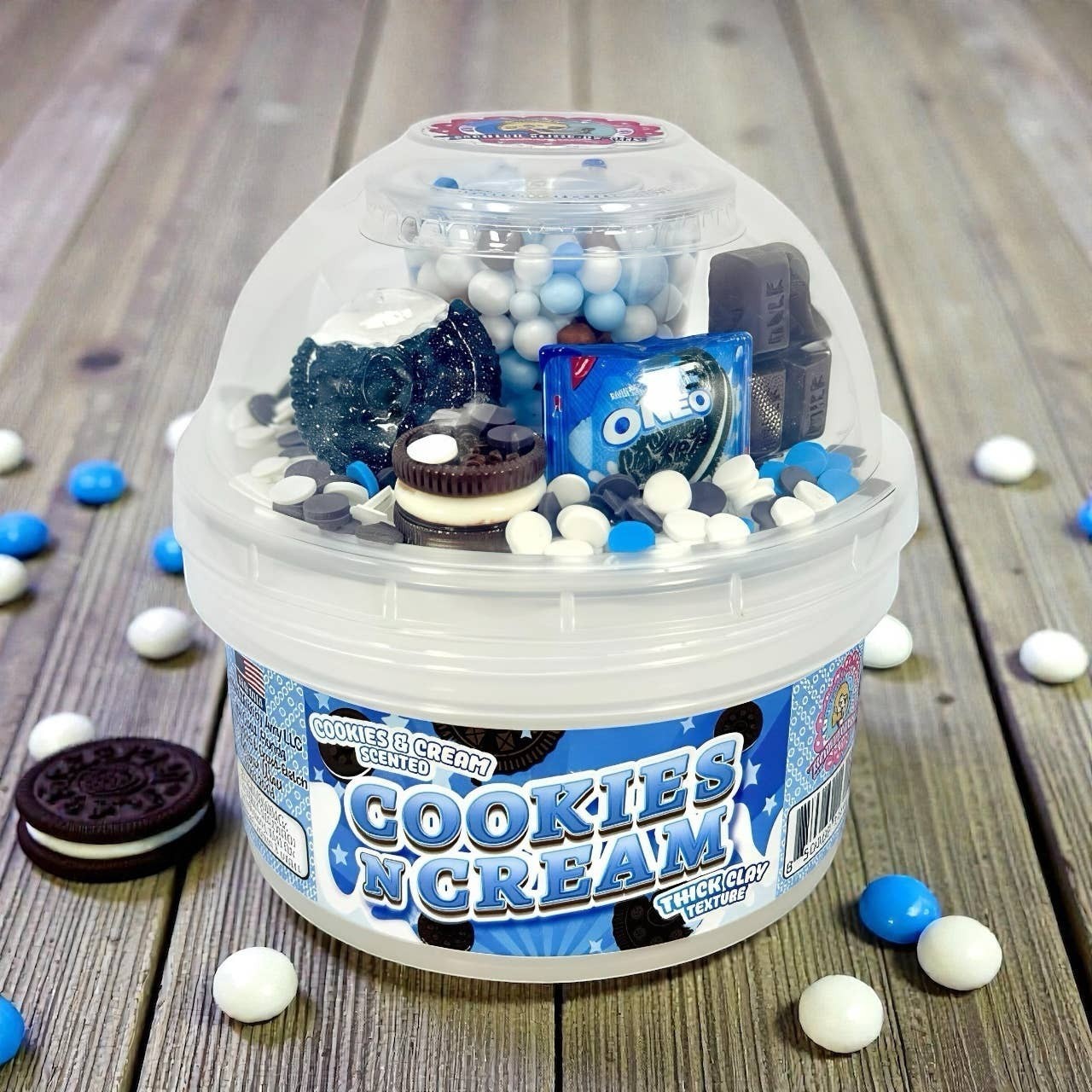 Doodlations Coffee Bar & Boutique Cookies and Cream Scented Slime kit with Oreo charms, sprinkles, and blue and white candy.