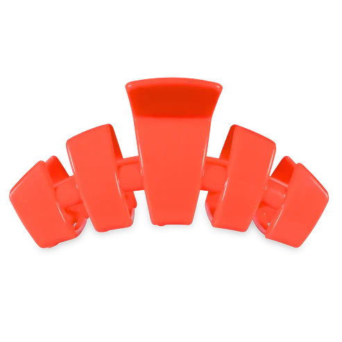 Doodlations Coffee Bar & Boutique coral segmented hair claw clip, durable flexible material for secure hold.
