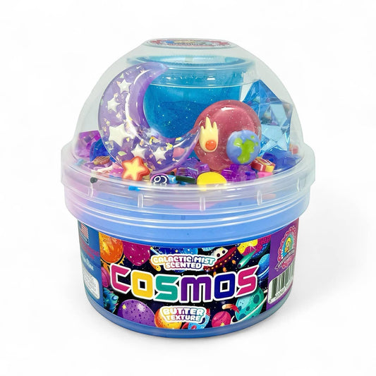 Doodlations Cosmic Slime Kit with blue glitter butter slime and space-themed charms like moons, stars, and planets.