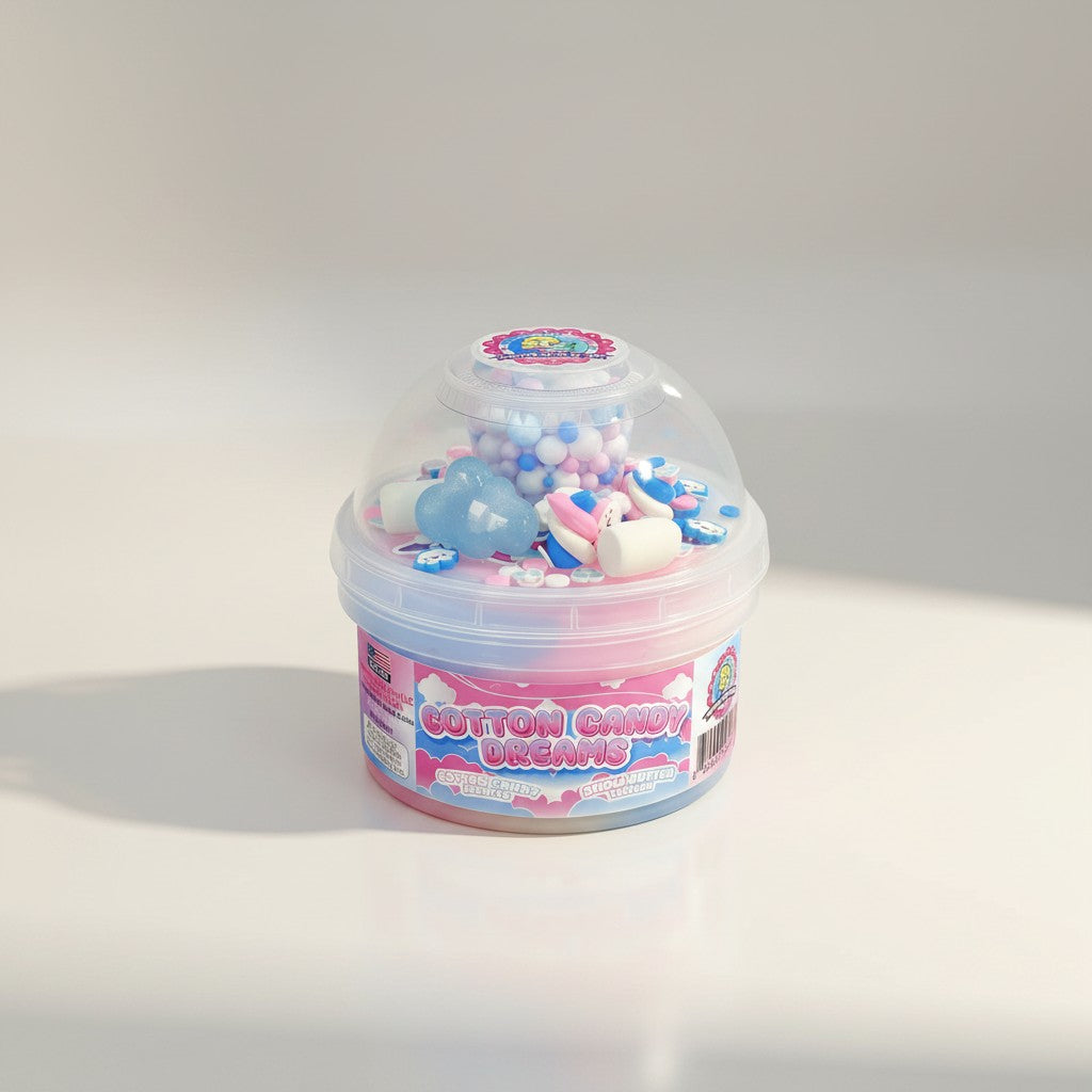 Doodlations Coffee Bar & Boutique Cotton Candy Dreams slime with pink, blue, and white swirls, fluffy texture, and cotton candy charms.