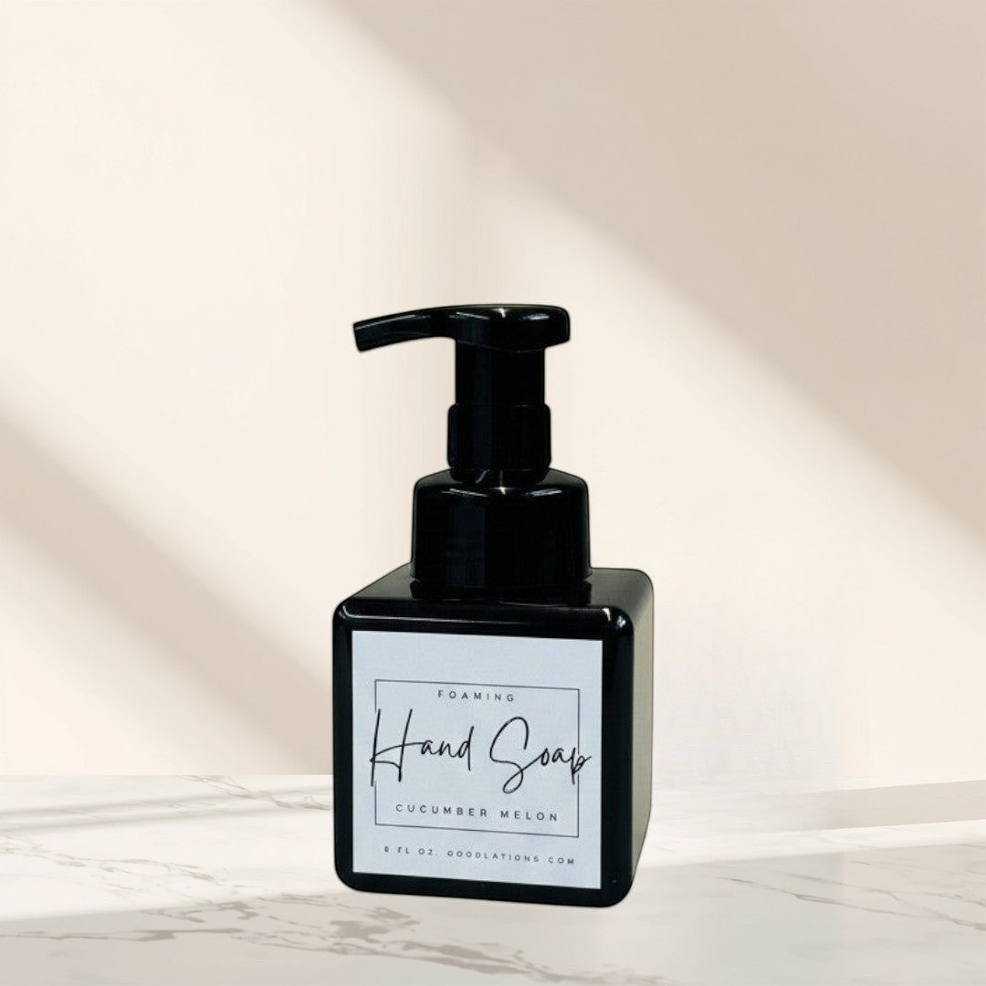 Doodlations Coffee Bar & Boutique black foaming hand soap dispenser with Cucumber Melon scent label.