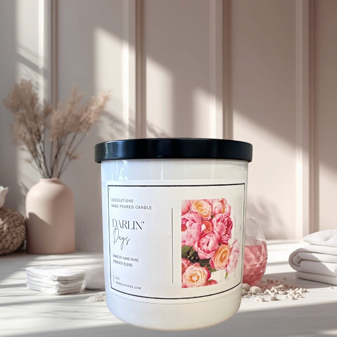 Doodlations Darlin' Days hand-poured soy blend candle with a floral label and black lid.