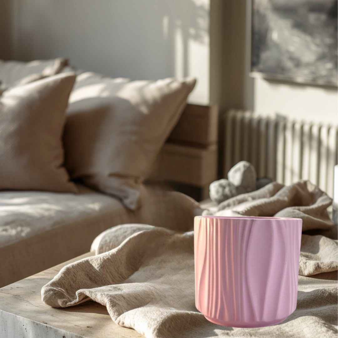 Doodlations Darlin’ Days pink marbled concrete candle vessel with vertical wave pattern.