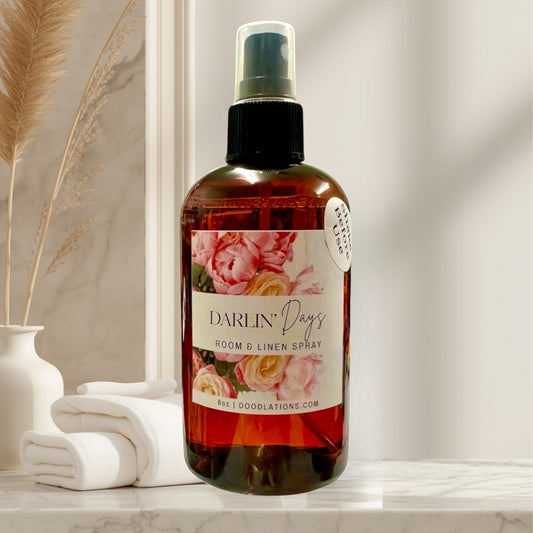 Doodlations Coffee Bar & Boutique Darlin' Days room and linen spray in amber bottle with floral label. 8oz.