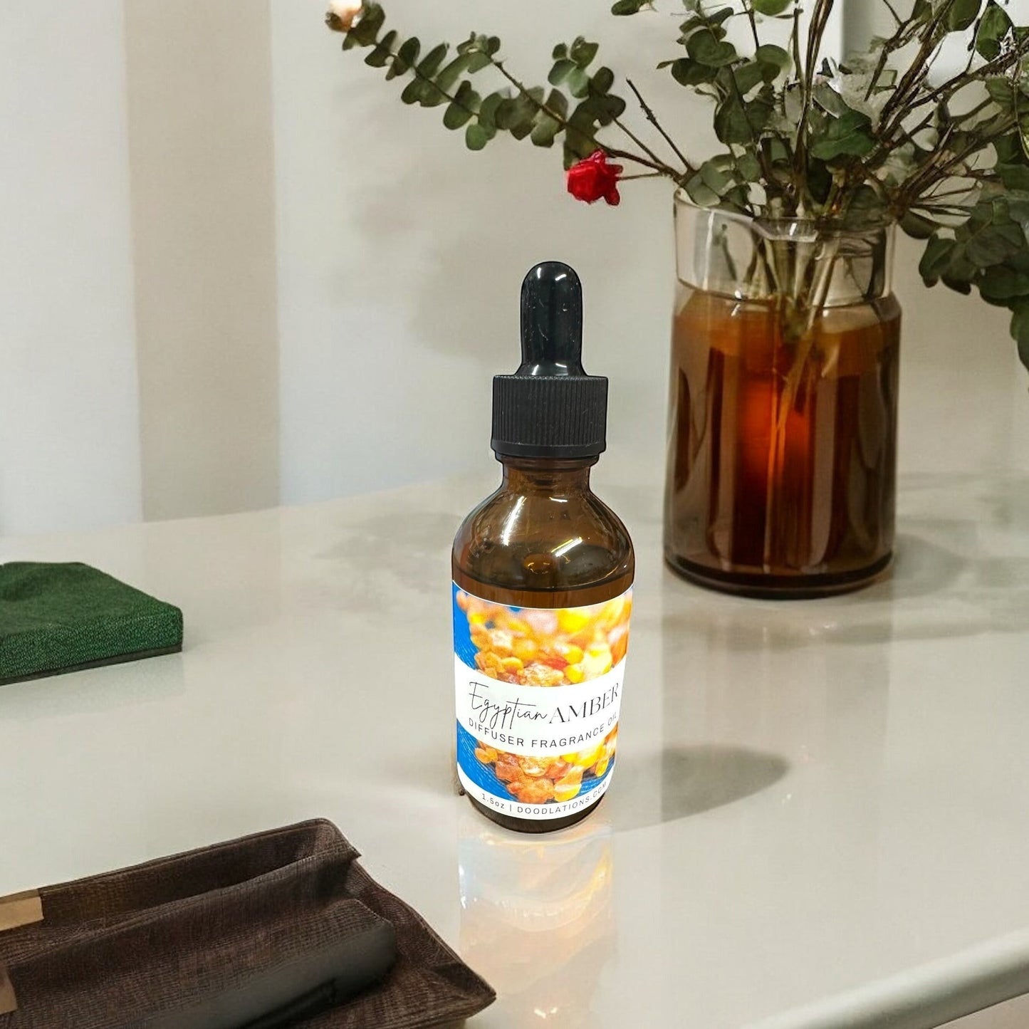 Doodlations Coffee Bar & Boutique Egyptian Amber diffuser fragrance oil in amber glass bottle with dropper.