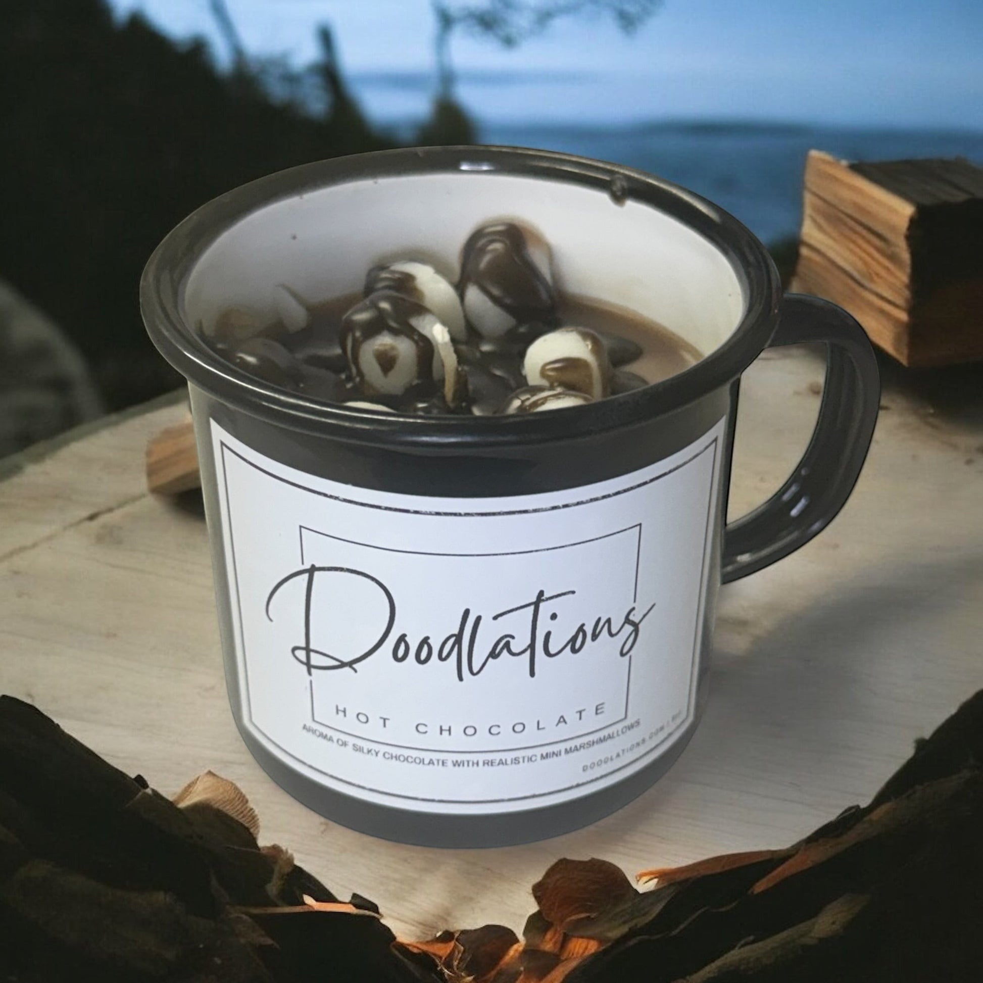Doodlations enamel camping mug candle with hot chocolate and marshmallow scent.