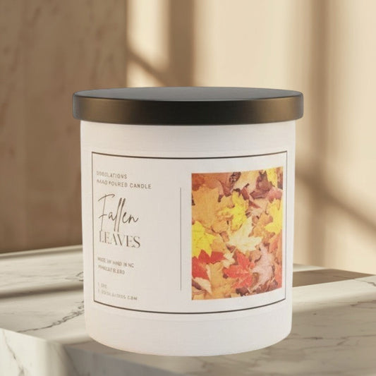 Doodlations Coffee Bar & Boutique Fallen Leaves candle with autumn leaf label. 8 oz.