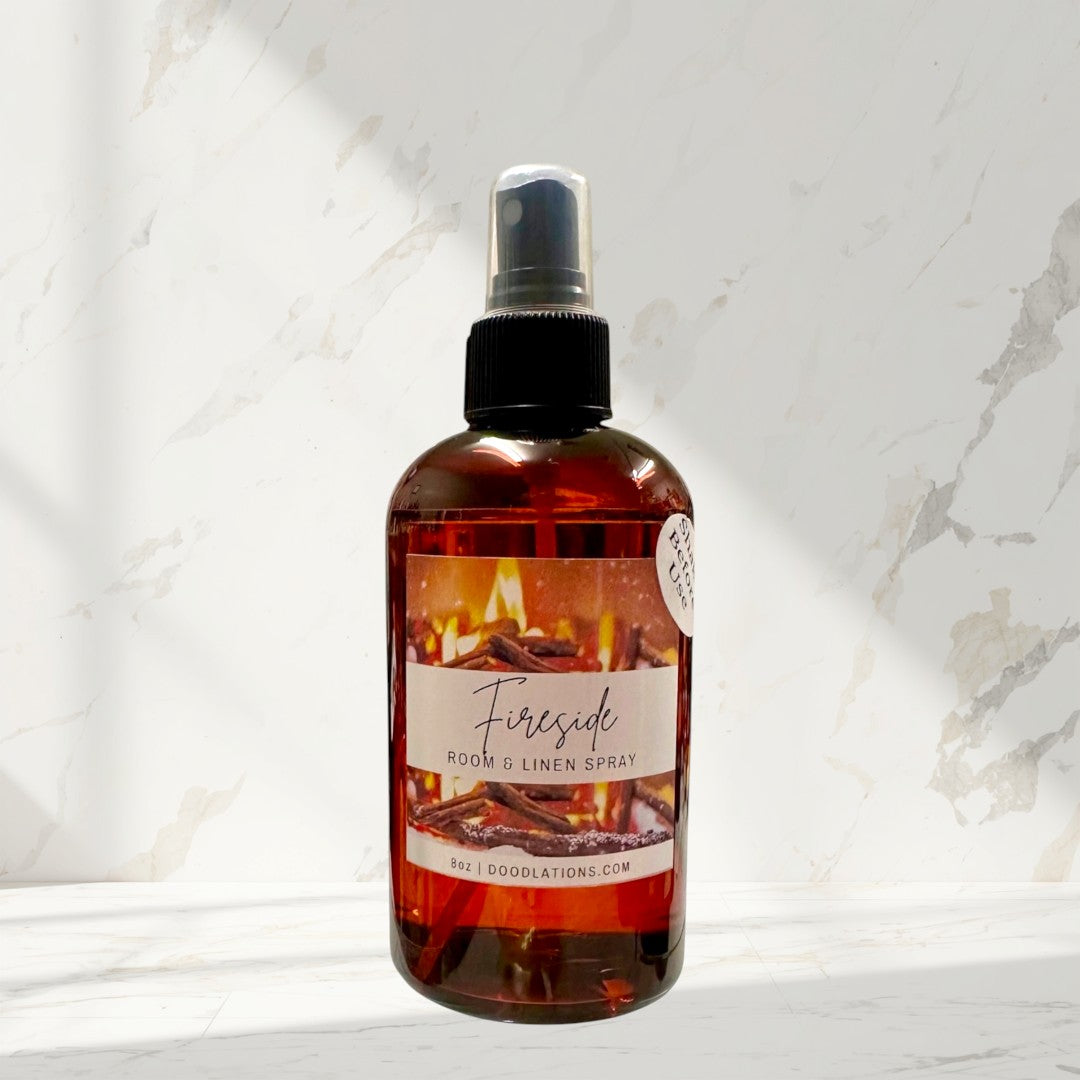 Doodlations Fireside room and linen spray in amber bottle with a cozy fireplace label. 8oz.