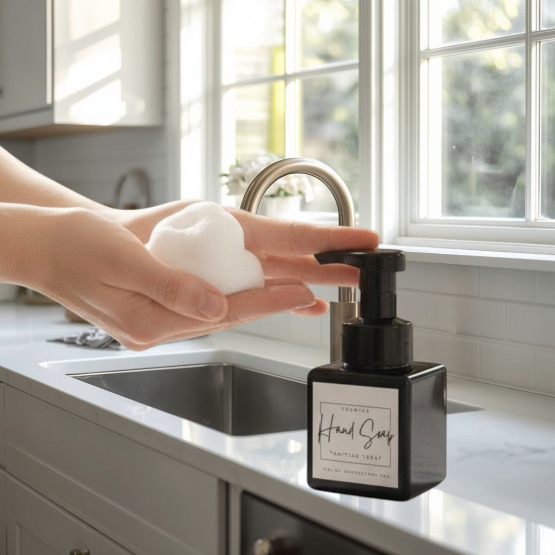 Doodlations Coffee Bar & Boutique Tahitian Treat foaming hand soap in a black square bottle with a black pump dispenser.