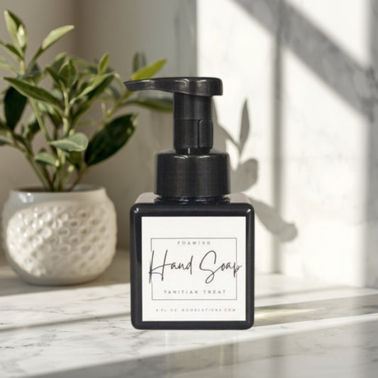 Doodlations Coffee Bar & Boutique Tahitian Treat foaming hand soap in a black square bottle with a black pump.