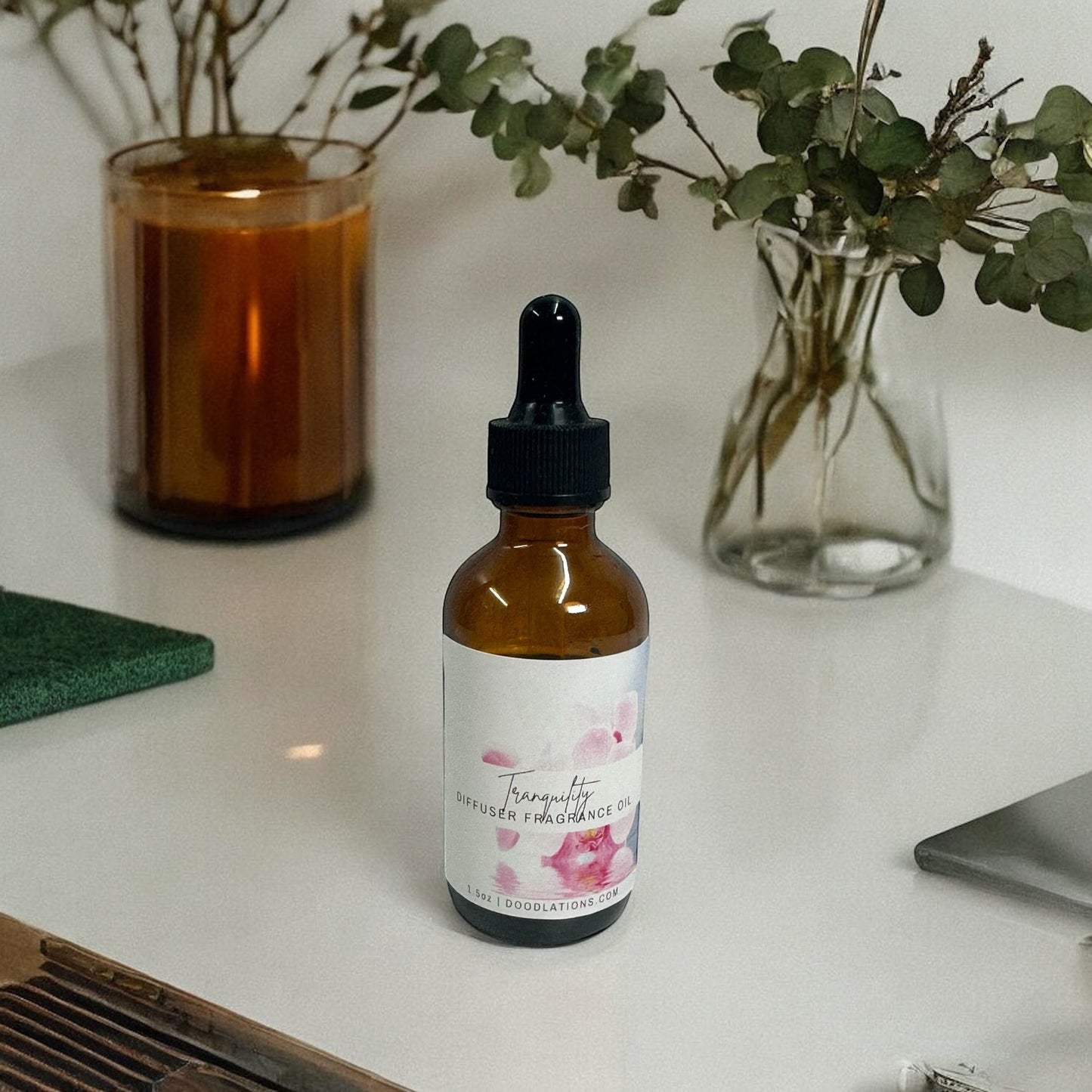 Doodlations Coffee Bar & Boutique Tranquility diffuser fragrance oil in amber glass bottle with dropper, 1.6oz.