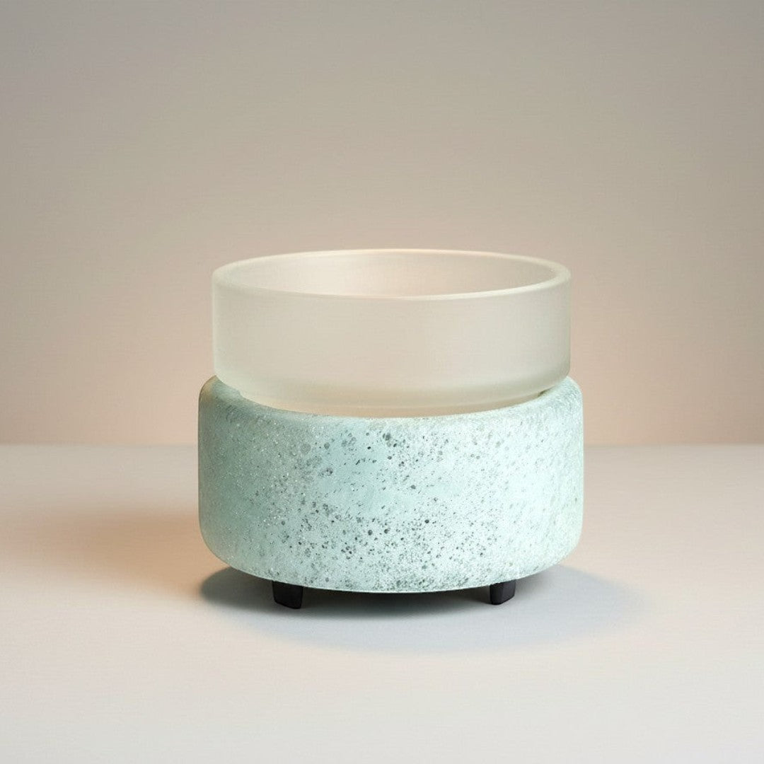 Doodlations Coffee Bar & Boutique frosted glass wax warmer with textured blue-green base and white dish.