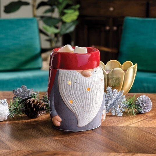 Doodlations Coffee Bar & Boutique gnome wax warmer with red hat, grey body, and white beard with glowing lights.