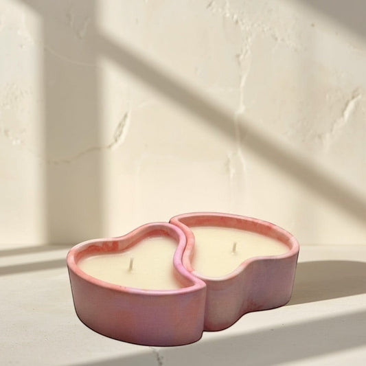 Doodlations Coffee Bar & Boutique heart-shaped concrete candle with pink and purple marbled finish, filled with creamy white soy wax.