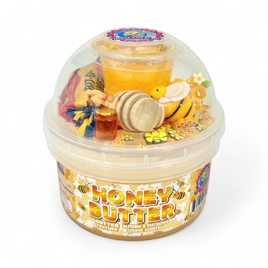 Doodlations Honey Butter Cookie Scented Slime with bee charm, honey dipper, and mini honey jar.