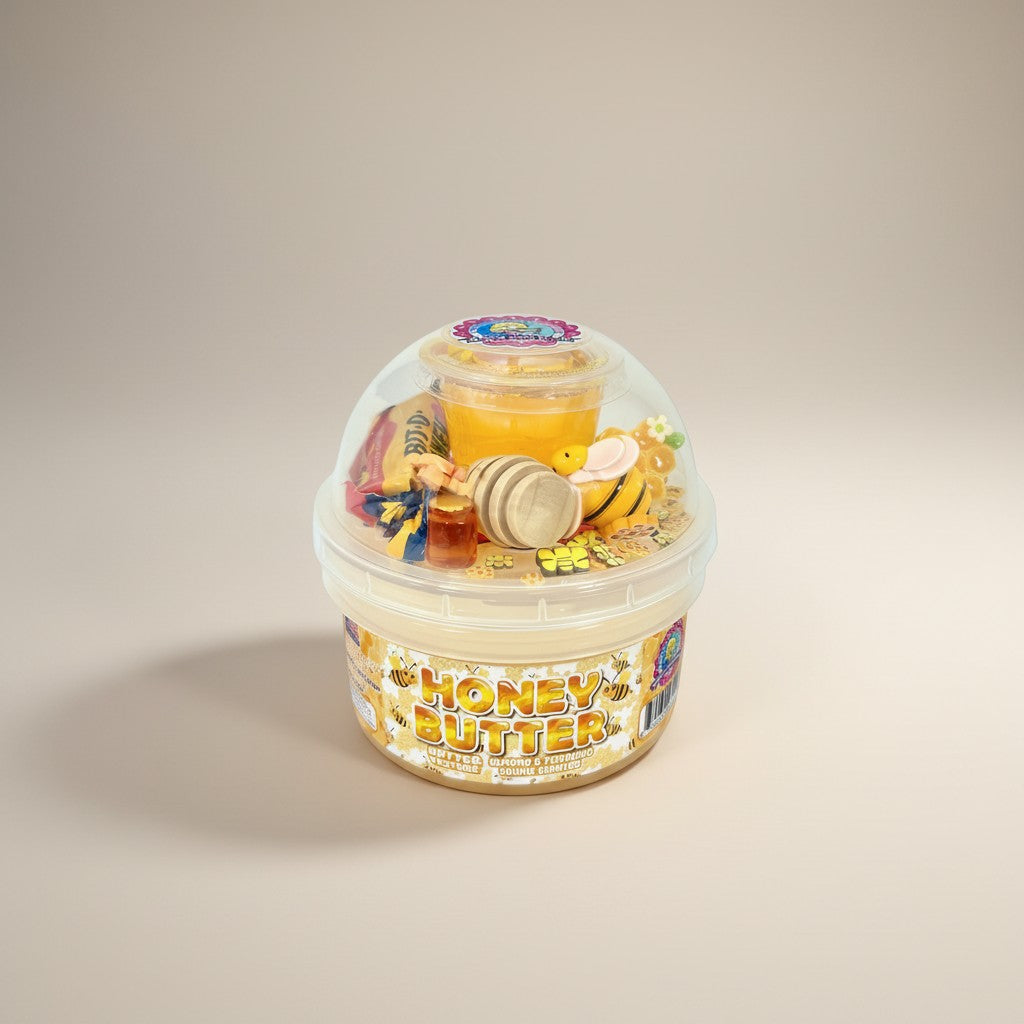 Doodlations Coffee Bar & Boutique Honey Butter slime with a thick, buttery texture, scented with almond and pistachio cookies. Includes bee charm, honey drizzle, and dipper.