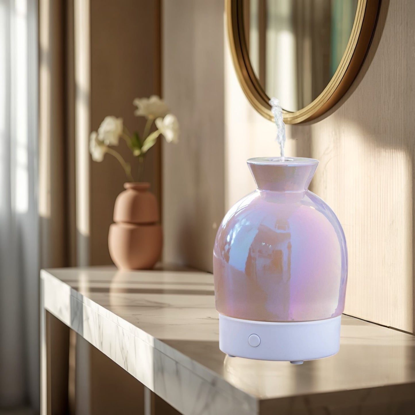 Doodlations Coffee Bar & Boutique iridescent aromatic diffuser with pearlescent hues and white base, emitting steam.