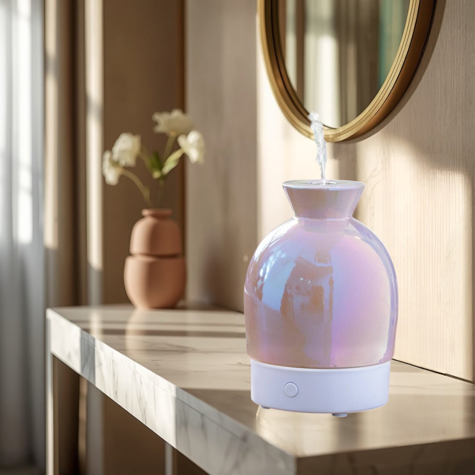 Doodlations Coffee Bar & Boutique iridescent aromatic diffuser with pearlescent hues and white base, emitting steam.